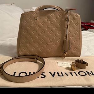 Authentic Louis Vuitton Montaigne mn bag .